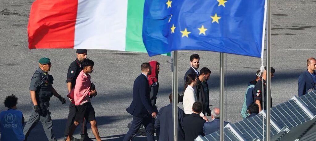 Italy’s Migrant Issue Caught in Rigmarole of Court Ruling 1 An Italian navy vessel returned 12 migrants to Italy from an Albanian center on Saturday. This follows a court decision questioning the Italian government’s move to transfer migrant processing to the Balkan nation.