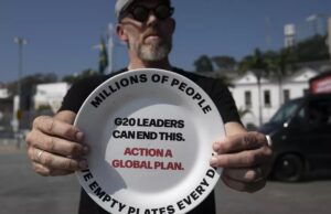 Activists Protest in Rio Near G20 Summit Venue with Empty Plates Symbolising Hunger