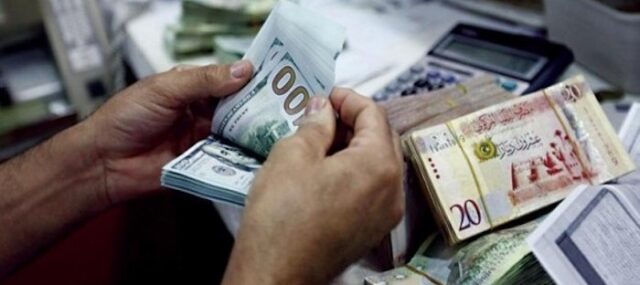 Currency Libya Libya’s central bank devalued the country’s currency by 13.3 percent on Sunday amid ongoing fiscal strain. The exchange rate for the dinar has now been set at 5.5677 to the US dollar, effective immediately.